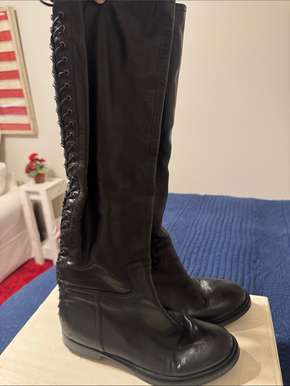 Woman’s Miu Miu black goat leather boots w/leather laces up the back. Size 38.5
